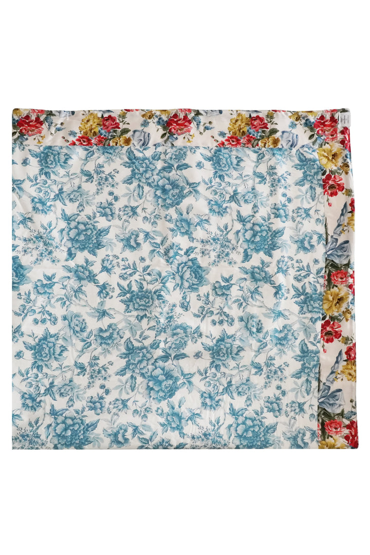Floral patterned fabric with a colorful border on a white background