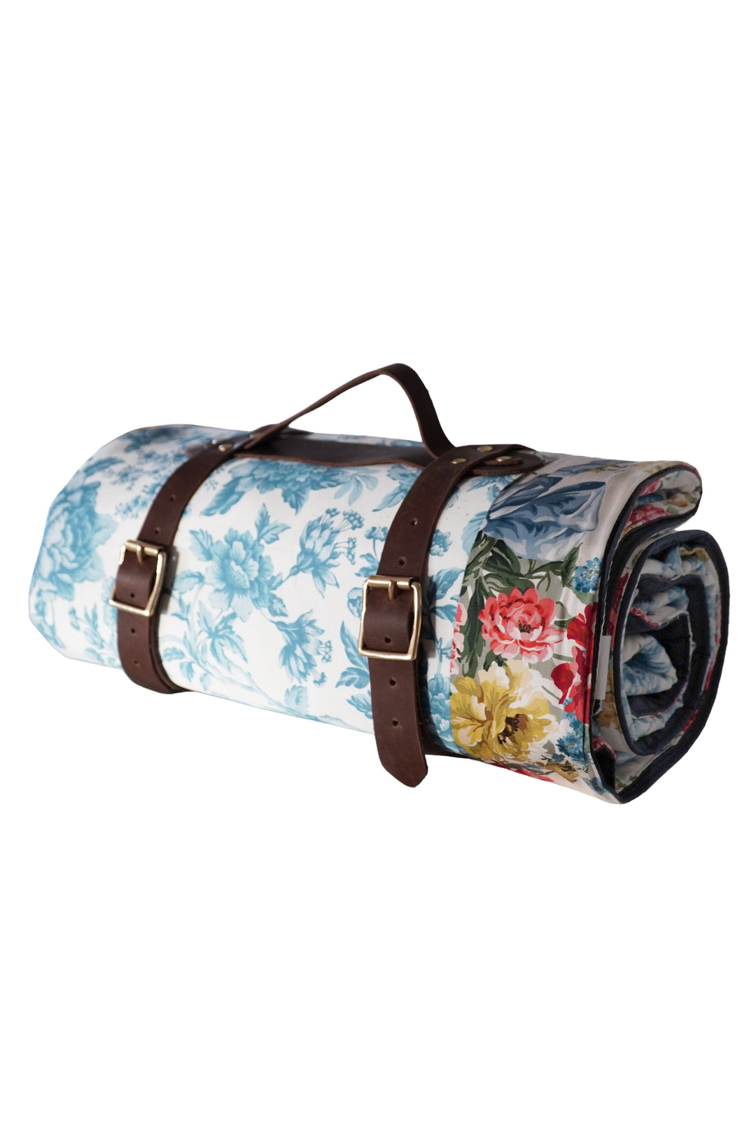 Floral-patterned roll-up rug with brown straps on a white background