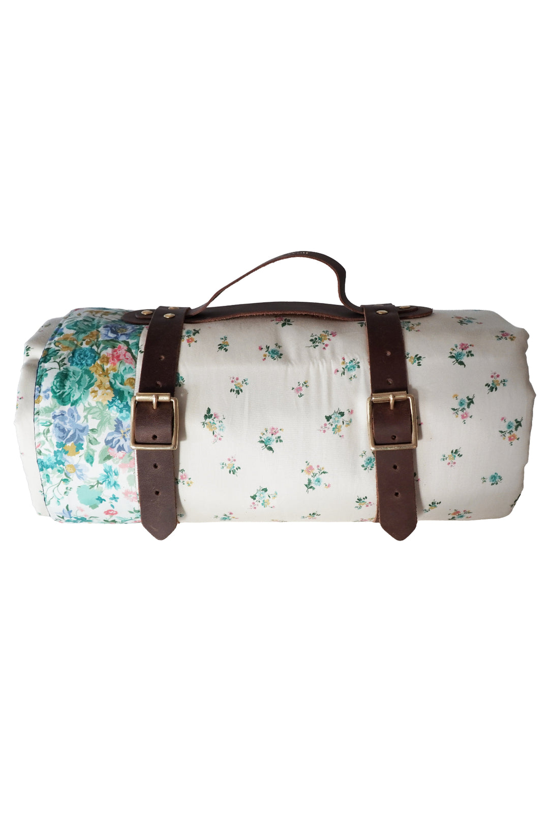 Floral-patterned duffel bag with brown leather straps on a white background