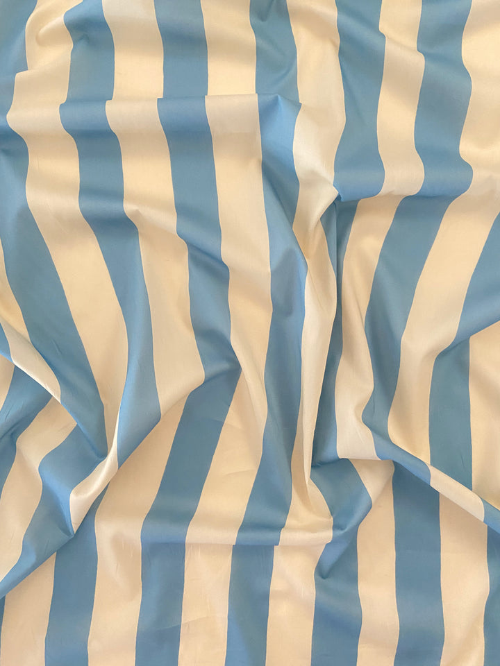 Striped fabric with blue and beige vertical stripes