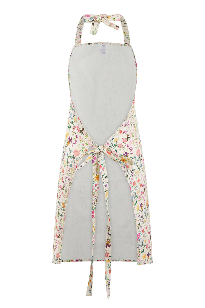 Floral apron with floral tie details on a white background