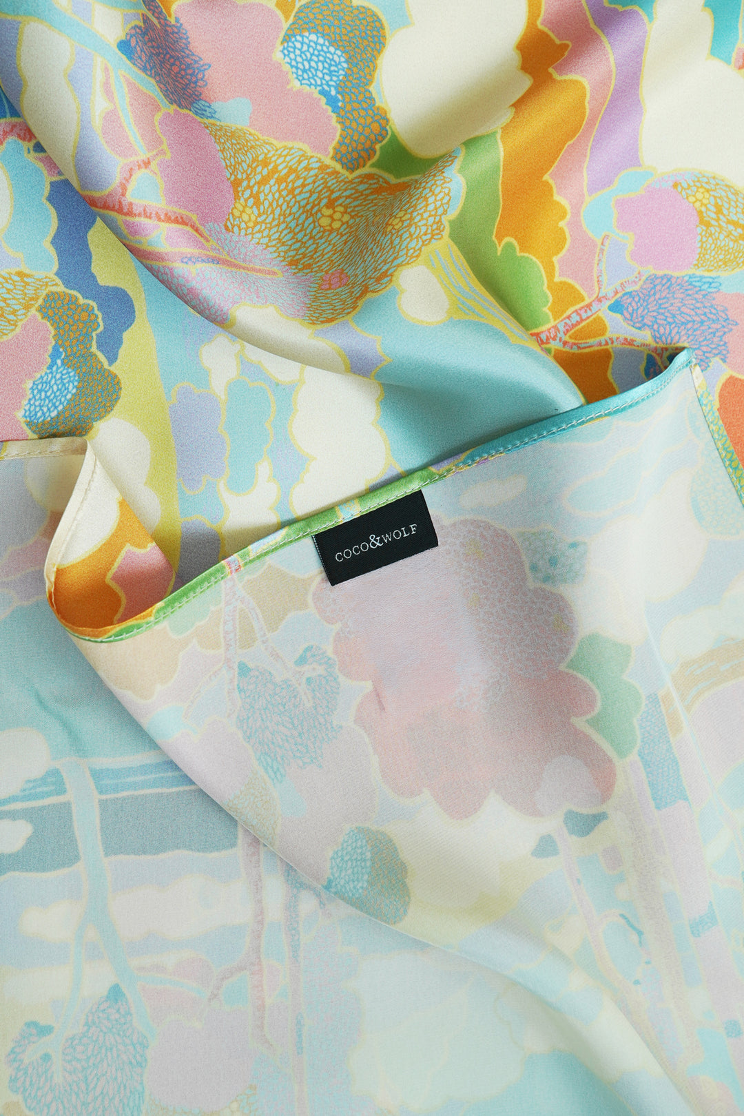 Close-up of silk scarf showing Liberty fabric print and fine rolled edges